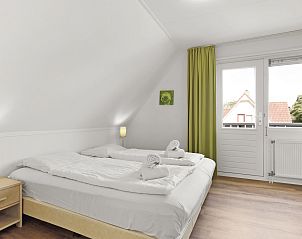 Gezellige slaapkamer details in Villapark Vogelmient 4-persoons vakantiehuis, Texel.