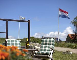 Outdoor terrace at Grand Hotel Opduin - Holiday home A, De Koog, Texel, perfect for relaxing in the fresh air.
