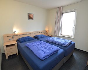 Comfortabele slaapkamer met tweepersoonsbed in Vakantiehuis Stappeland 171, De Koog, Texel.