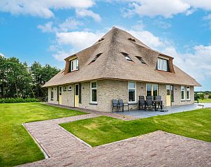 Gezellig vakantiehuis in De Koog, Texel met uitnodigend terras en groene omgeving.