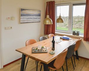 Dining area with view in Duinrand Holiday Villas Type 1 in De Koog, Texel.
