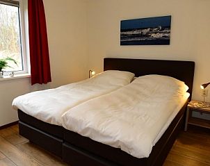 Bedroom with double bed in Duinrand Holiday Villas Type 1 in De Koog, Texel.