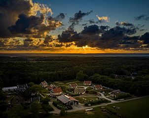 Aerial view of Duinrand Holiday Villas Type 1 in De Koog, Texel at sunset.