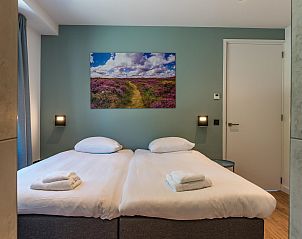 Komfortables Schlafzimmer in Bruine Kiekendief Ferienhaus Den Burg Texel mit ruhiger Atmosphre.