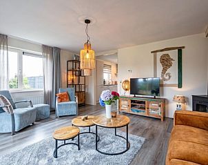 Gemtliches Wohnzimmer im Ferienhaus in Den Burg, Texel, mit moderner Einrichtung und komfortabler Sitzecke auf den Watteninseln.