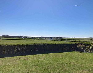 Schommel in de tuin van NH198 vakantiehuis Den Burg Texel.