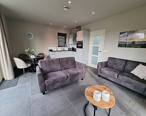 Comfortabele zithoek in vakantiehuis Schoonoordsingel 29a, Den Burg, Texel, ideaal voor ontspanning.