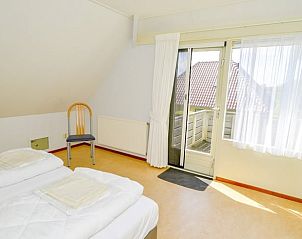 Gezellige slaapkamer met uitzicht in Vakantiehuis in Den Burg, Texel