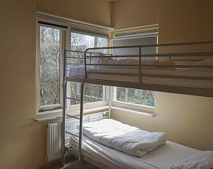 Gemtliches Kinderzimmer mit Etagenbetten im Garden Wall Ferienhaus Oosterend Texel, ideal fr Familien.