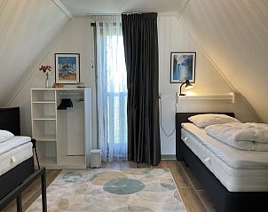 Comfortabele slaapkamer met uitzicht in Type II - nr. 79 Zilvermeeuw, vakantiehuis in Oosterend, Texel.