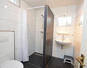 Modern bathroom in Holiday home the Pearl 198 in De Dennen, Texel with walk-in shower and stylish decor.
