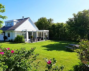 Bungalowpark De Parel - WELMOED in De Dennen, Texel, mit sonniger Terrasse und grnem Garten.