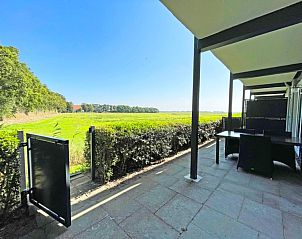 Schne Aussicht von der Terrasse des Appartements Bos en Duin 14, De Dennen, Texel, ber die weiten Felder.