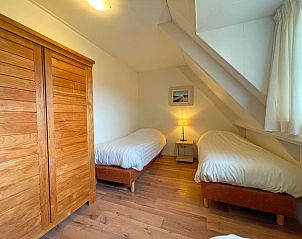 Balkon des Appartements Bos en Duin 41 in De Dennen, Texel mit Panoramablick auf die grne Landschaft.