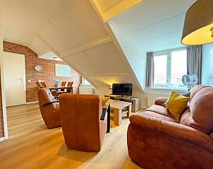 Spacious and bright living room of Apartment Bos en Duin 34 in De Dennen, Texel.