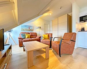 Modern living room in Apartment Bos en Duin 34, Texel with stylish furniture.