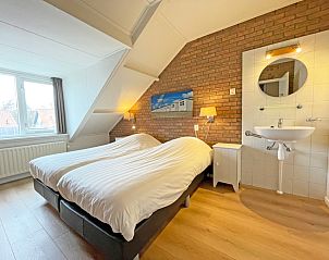 Attractive bedroom with double bed in Apartment Bos en Duin 34, Texel.