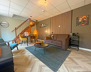 Stijlvolle zithoek in Appartement Bos en Duin 24, De Dennen, Texel. Ideaal vakantieverblijf op de Waddeneilanden.