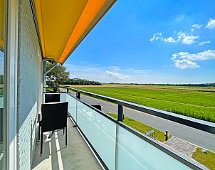 Luchtfoto van Appartement Bos en Duin 16 in De Dennen Texel met omringende groene omgeving.