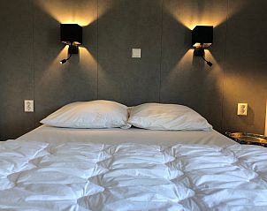 Sfeervolle slaapkamer in Vakantiehuis Vakantiepark de Bremakker - Bosveld 121, De Dennen, Texel.