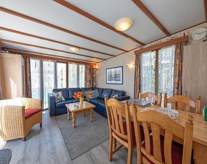Bright living room in Holiday Park de Bremakker Weideveld 61, Texel, vacation home in De Dennen with large windows.