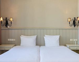 Comfortabele slaapkamer in Hotel Bigarr Maastricht Centrum, vakantieappartement in Limburg.