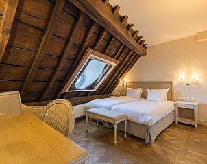 Sfeervolle zolderkamer in Hotel Bigarr Maastricht Centrum, vakantieverblijf in Zuid Limburg.