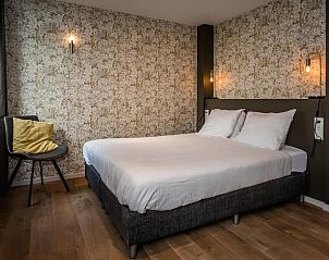 Moderne slaapkamer in Loods Hotel Vlieland, vakantieappartement op Vlieland, met comfortabele bedden.