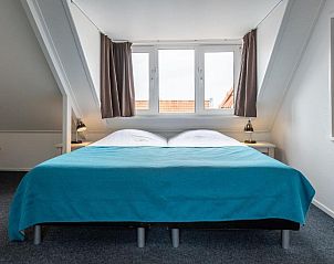 Ruime slaapkamer in Hotelletje de Veerman, vakantieappartement in Vlieland, Waddeneilanden.