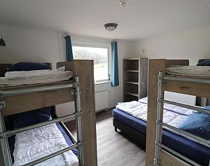 Gezellige slaapkamer met stapelbedden in Sier aan Zee vakantiehuis, Hollum, Ameland.