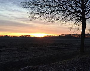 Adembenemende zonsondergang bij Amelander Kaap Appartement 112, Hollum, Ameland.