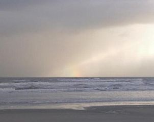 Wolken boven de zee bij Amelander Kaap Appartement 112, Hollum, Ameland.
