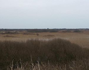 Zonsondergang over strand nabij Amelander Kaap Appartement 112, Hollum, Ameland.