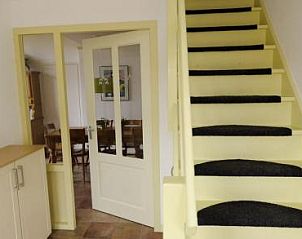 Stairs and entrance to the Farmhouse in Hoorn, Terschelling, with access to the spacious indoor area.