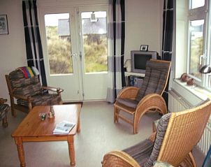 Cozy living room of vacation home Pirola, Midsland aan Zee, overlooking the dunes.