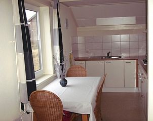 Kitchen of vacation home Pirola in Midsland aan Zee, Terschelling, with modern amenities.
