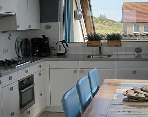 Modern kitchen in Nij Jit vacation home, Midsland aan Zee Terschelling, overlooking dunes.