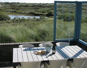 Sunny terrace of Nij Jit vacation home, Midsland aan Zee Terschelling, overlooking nature.