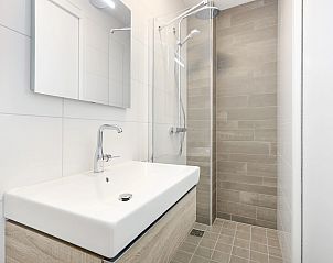 Uitzicht vanaf het balkon van het 4-persoons appartement 4C2 in West-Terschelling, Terschelling, met zicht op de Waddeneilanden.