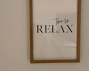 Inspirerende wanddecoratie in Vakantiehuisje in Ballum, Ameland, moedigt aan tot ontspanning en rust.