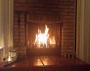 Cozy fireplace in Jans bungalow, Ballum, Ameland, for warm evenings on the Wadden Islands.