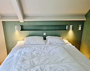 Sfeervolle slaapkamer in Vakantievilla 'Sieta', Ballum, Ameland. Rustgevend vakantiehuis op de Waddeneilanden.