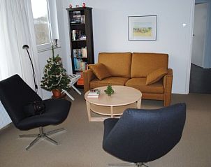 Gezellige zithoek in Oase vakantiehuis, Buren, Ameland voor ontspanning.