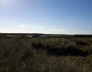 Uitzicht op het duinlandschap nabij Vakantiehuisje in Hollum op Ameland, een serene plek op de Waddeneilanden.
