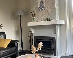 Sfeervolle open haard in Beppe van Ameland vakantiehuis, Waddeneilanden.