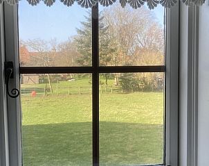 Uitzicht vanuit slaapkamerraam in Beppe van Ameland vakantiehuis, Waddeneilanden.