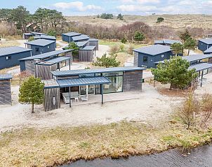 Luchtfoto van Vrijstaande woning in Hollum, Ameland te midden van groen.