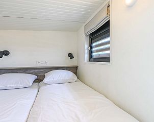 Stapelbed in kindvriendelijke kamer van Vrijstaande woning in Hollum, Ameland.