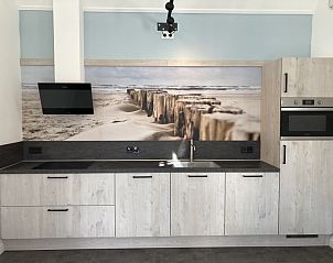 Christmas atmosphere in vacation home 't Roefke in Hollum, Ameland with illuminated mini Christmas tree.