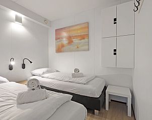 Comfortabele slaapkamer in Ameland State 4-persoons appartement in Nes, Ameland met frisse inrichting.